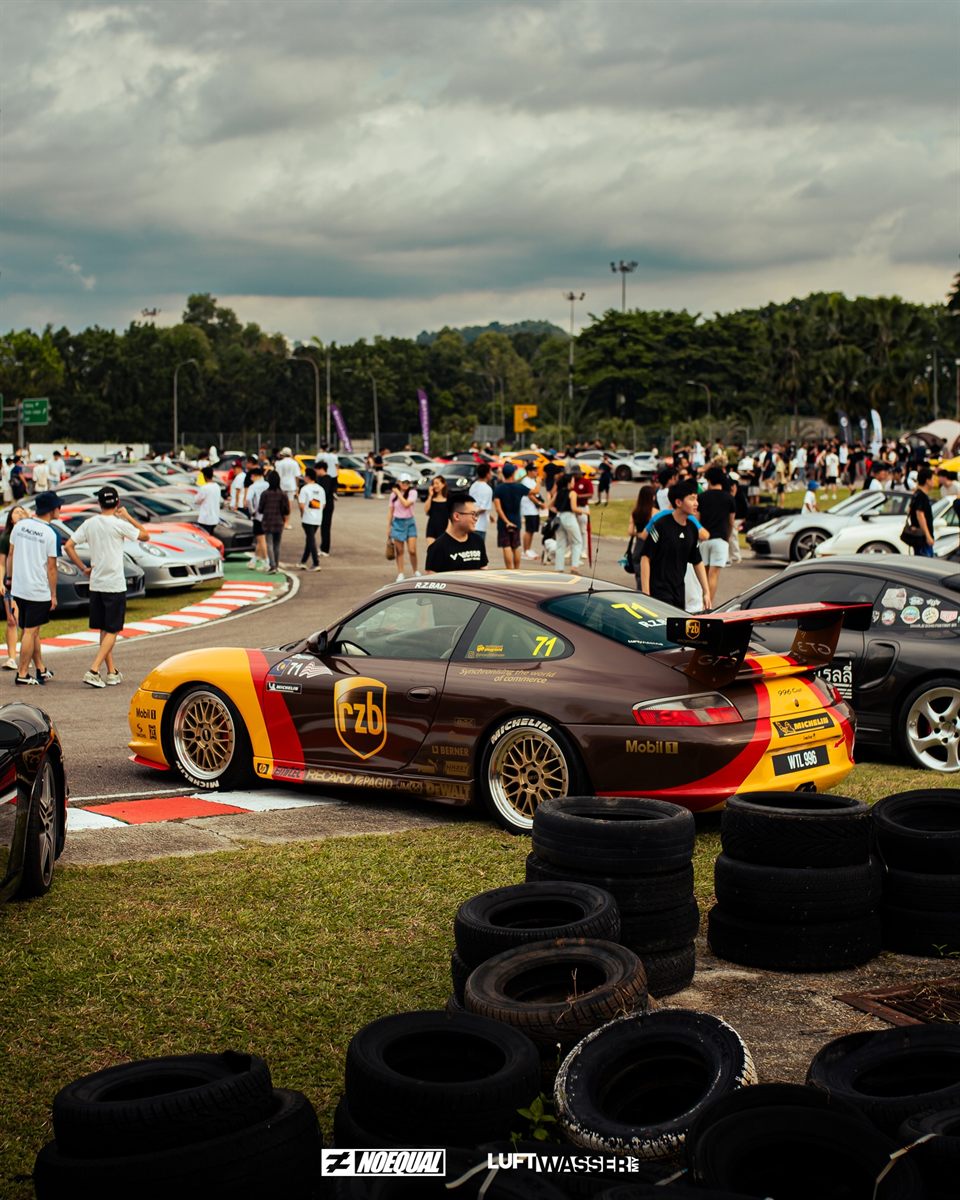 996 Cup in brown and yellow RZB race livery parked by the tyre wall
